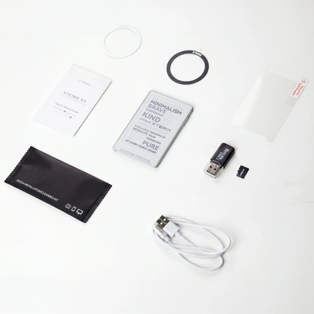 Xteink X3 eReader with accessories: USB cable, microSD card, screen protector, cleaning kit, and quick start guide on white background.